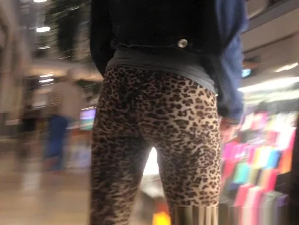 teen 18+ in leopard leggings at the shopping mall