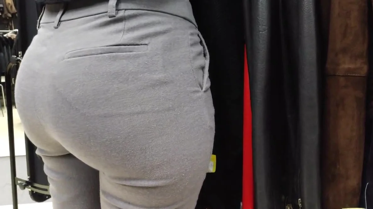 Delicious juicy butts saleswoman in very tight dress pants