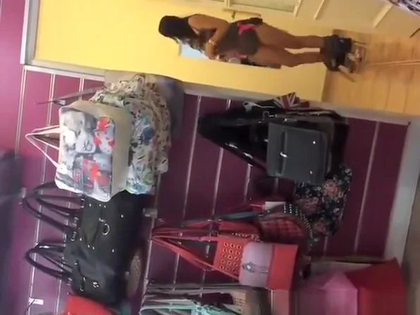 Sexy chick with tattoo in store