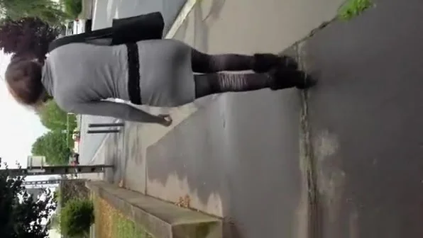 Guy cums on womans back in the street
