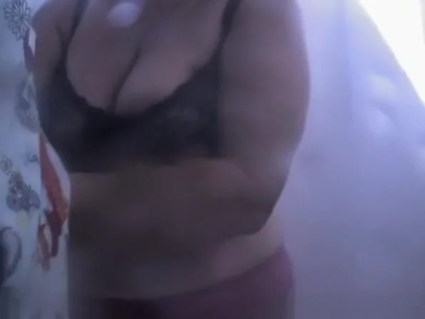 Chubby mature woman caught in beach cabin