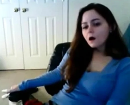 Babe has her hand down her sweat pants masturbating on cam