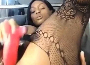 Lovely Ebony with big tits fucks dildo