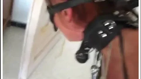 Blindfolded redhead slave girl obeys her master