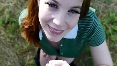 18 year old redhead sucking dick on an open field