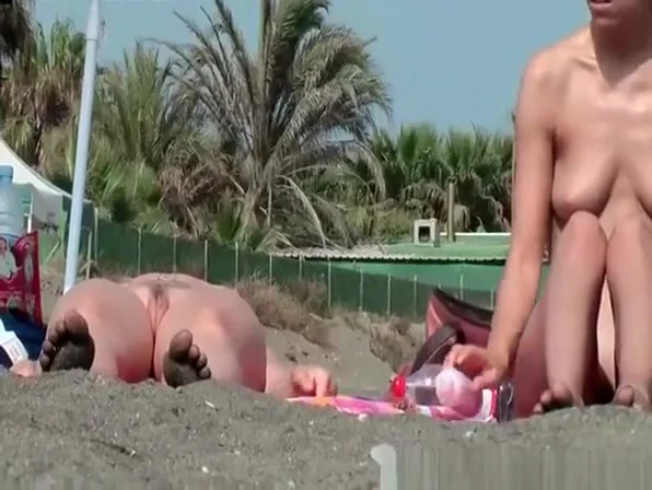Nudist chicks in water and sunbathing