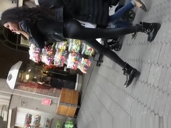 Skinny brunette in tight black pants
