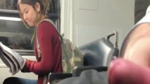 Chinese girl looking at my cock at the bus