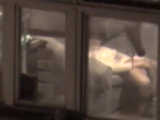 Lovely babe filmed masturbating through apartment window