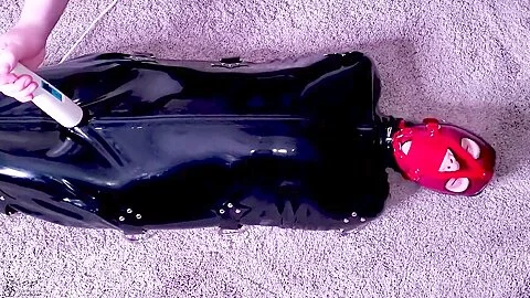 Tiny Slut Is Muzzle Gagged Then Locked In A Latex Sack & Made To Cum On A Magic Wand!