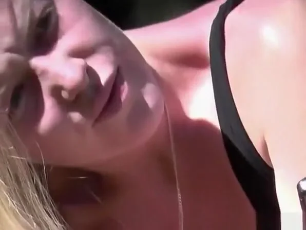 Blonde girl no panties sitting in the grass